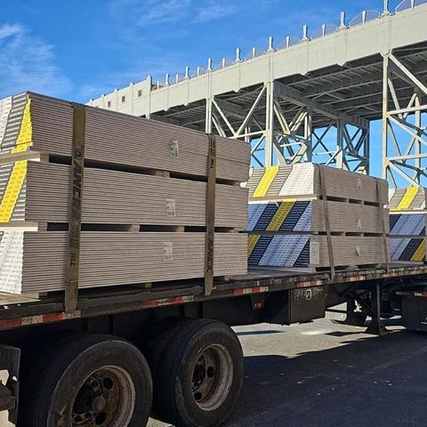 Flatbed loaded with Durock and sheetrock, ready to unload