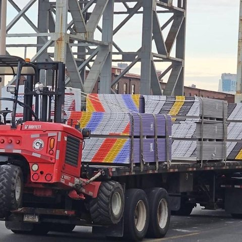 Truck-mounted forklift with mixed sheetrock under the elevated train